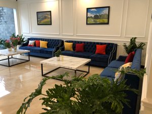 Paragon Noi Bai Hotel & Pool in Hanoi, image may contain: Couch, Living Room, Table, Coffee Table