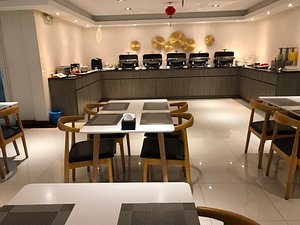 K.C Hotel in Yangon (Rangoon), image may contain: Restaurant, Cafeteria, Dining Table, Dining Room