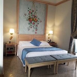 Comfortable Queen Bed in Genario Suite Hotel de la Ville Civitavecchia, Italy