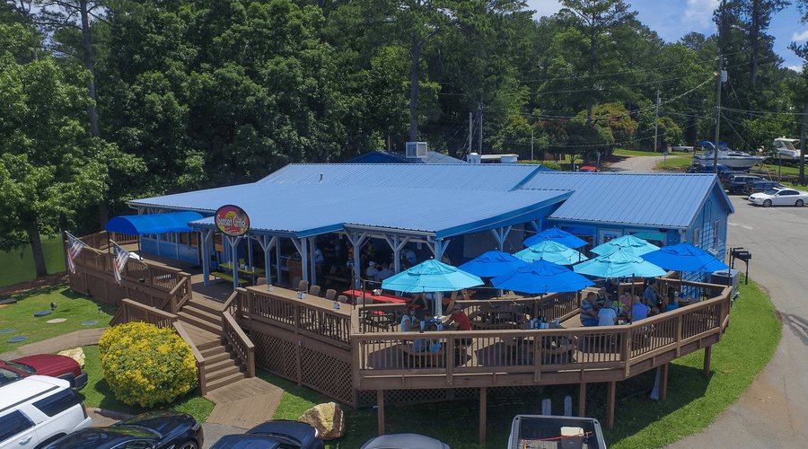 Sunset Grille on Lake Allatoona serves up excellent food while offering all that you would expect out of a great lakeside bar and restaurant. The cheerful and relaxed atmosphere at Sunset Grille makes everyone feel like a regular. No other restaurant on Allatoona can offer the same selection of delicious food and lakeside atmosphere as Sunset Grille. It has been a favorite of locals and tourists alike!

Our menu has a wide selection of dishes like tacos, nachos, wings, salads, sandwiches and muc