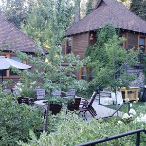 View  from Osprey cottage of the common area, fire pit and grilling areas.