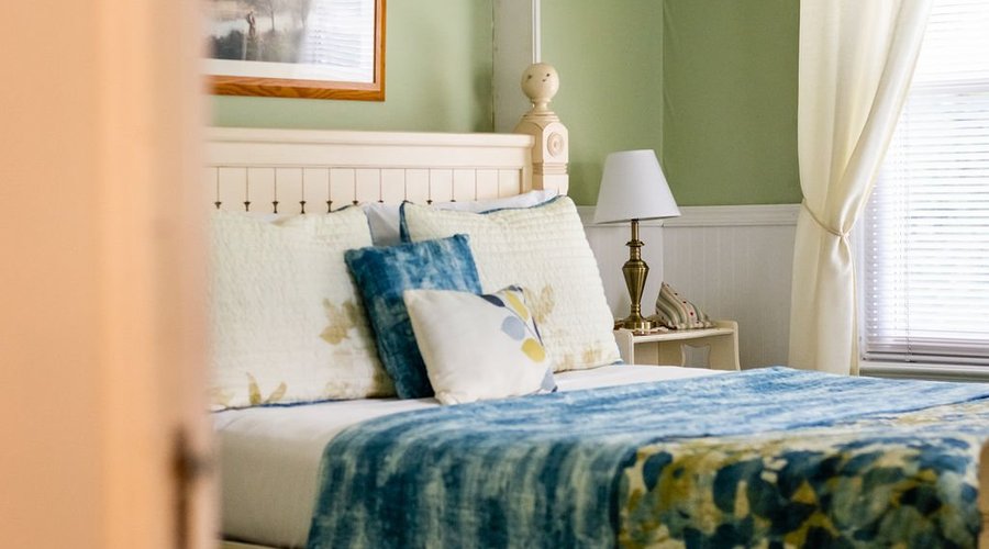 Our Dogwood Room has a Queen bed plus large private bathroom with bathtub and shower
