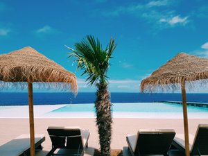 Pedras do Mar Resort & Spa in São Miguel, image may contain: Summer, Chair, Resort, Palm Tree