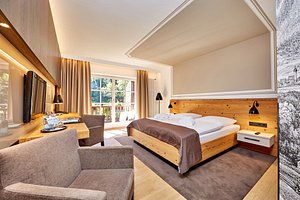 Hotel am Badersee in Grainau, image may contain: Interior Design, Furniture, Home Decor, Bedroom