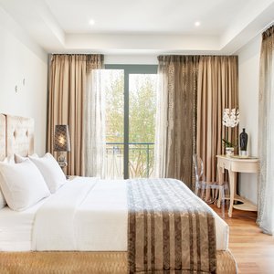Dioni Boutique Hotel in Preveza, image may contain: Living Room, Dining Room, Table, Home Decor