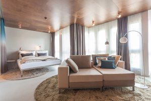 EMA House Hotel Suites in Zurich, image may contain: Home Decor, Rug, Interior Design, Furniture