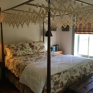 Beautiful canopy bed in our room.