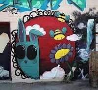 Graffiti and murals beautifully line the alley.