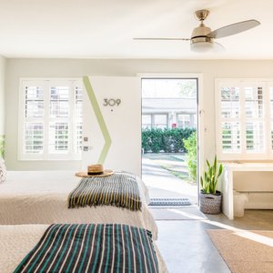 Hotel Palms in Atlantic Beach, image may contain: Door, Ceiling Fan, Electrical Device, Housing
