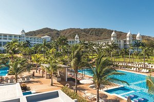Hotel Riu Palace Costa Rica in Sardinal, image may contain: Hotel, Resort, Person, Pool