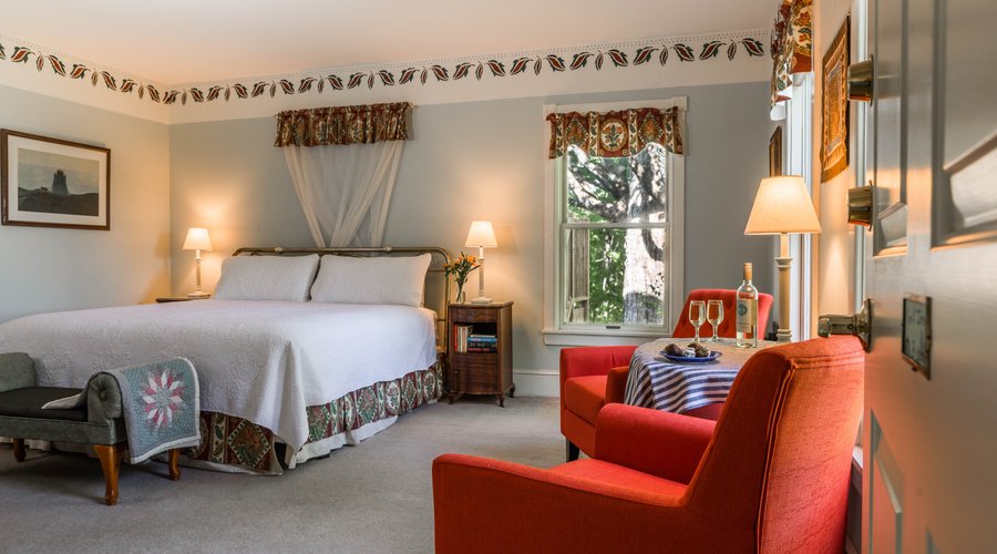 Room 8 is a large room with king size bed, two comfy chairs, a fireplace, lots of lamps, and power strips for all your electronics.  