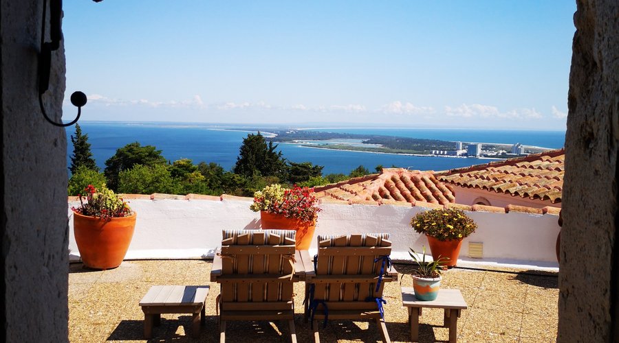 Walking out from the windmill, you step into your private terrace and enjoy the 180º view over the Sado Estuary and the Tróia Península