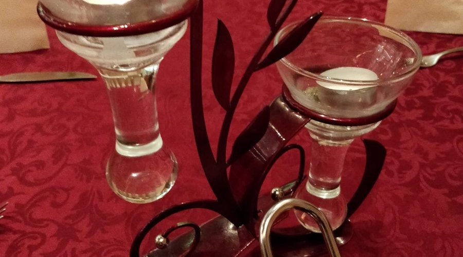 Candles waiting to get lit and lift your dining spirit 