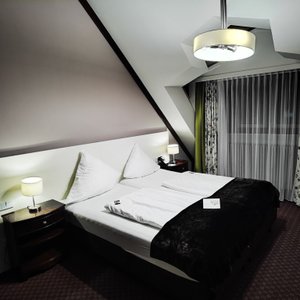 Exquisit Hotel in Munich, image may contain: Cushion, Home Decor, Bed, Pillow