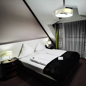 Exquisit Hotel in Munich, image may contain: Cushion, Home Decor, Bed, Pillow