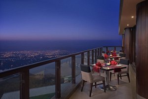 Sterling Mussoorie in Mussoorie, image may contain: Balcony, Building, Chair, Dining Table
