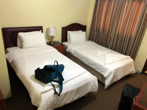 Al Rashid Hotel in Petra - Wadi Musa, image may contain: Lamp, Bed, Handbag, Bag