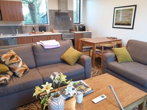 Rainforest Retreat in Franz Josef, image may contain: Couch, Furniture, Table, Living Room