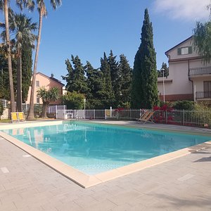 The largest Swimmingpool of the "Residence Oleandro" with lthe right distance between a deckchair and the other (covid19 prevention)