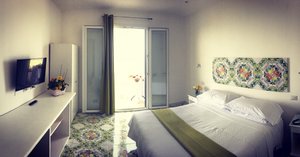 Hotel Villa Pina in Massa Lubrense, image may contain: Bed, Furniture, Bedroom, Indoors
