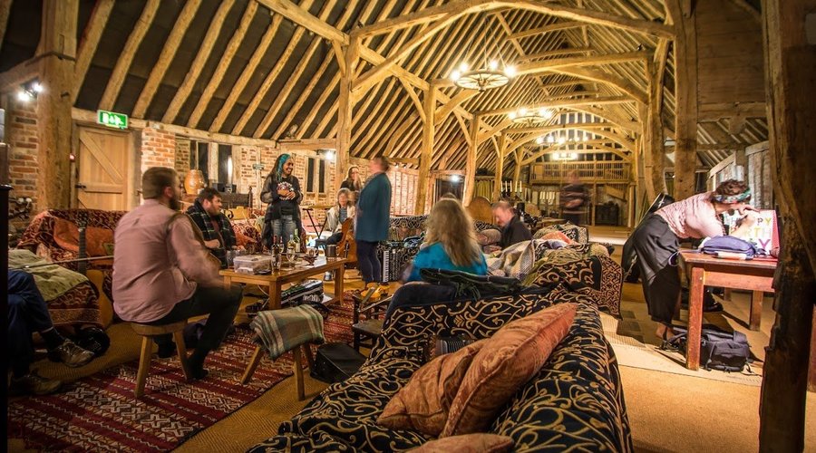 The sitting area around the woodburner seats 23+ guests