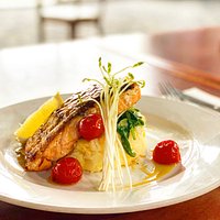 Grilled Salmon Fillet - Served with creamy mashed potato, wilted spinach, confit cherry tomato, citrus glaze.