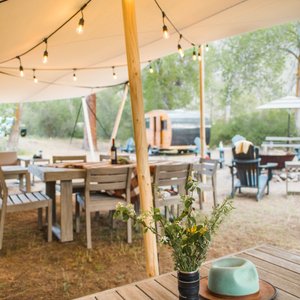 Outdoor amenities include outdoor gas stove top, outdoor gas BBQ, covered lounge and dining area, fire pit and deck chairs, boat launch and river access, and a hammock