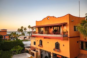 Posada LunaSol Hotel in La Paz, image may contain: Resort, Hotel, Villa, Person