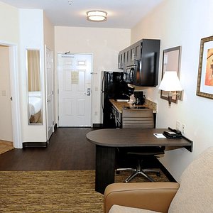 Studio suite offering a kitchen, work desk, leather recliner, flat screen TV and DVD player 