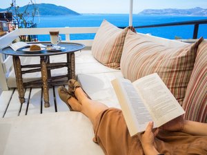 Hideaway Hotel in Kas, image may contain: Reading, Couch, Furniture, Book