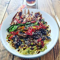 Poke bowl with chicken, noodles, avocado, sugar snap peas, mixed peppers, chilli and terriyaki sauce.