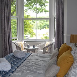 Sennen a lovely bright super king double room with ensuite shower room and a sunny bay window.