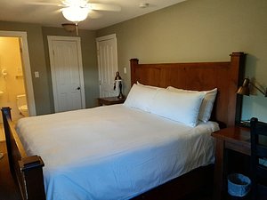 Bayside Inn in Parry Sound, image may contain: Furniture, Bed, Chair, Bedroom