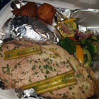 Slow Roast Prime Rib with Baked Potatoes Hush Puppies