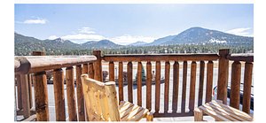 Alpine Trail Ridge Inn in Estes Park, image may contain: Wood, Porch, Railing, Deck