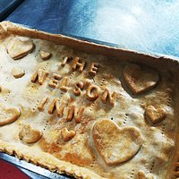 Homemade country pie, filled with Gammon, Turkey, Stuffing, and country gravy