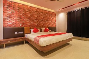 Hotel Hicola Heritage, Kakarvitta in Kakarvitta, image may contain: Interior Design, Indoors, Bed, Furniture