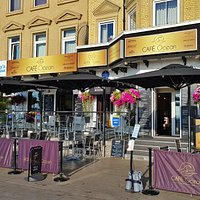 Our beautiful front terrace and patio area covered by umbrellas