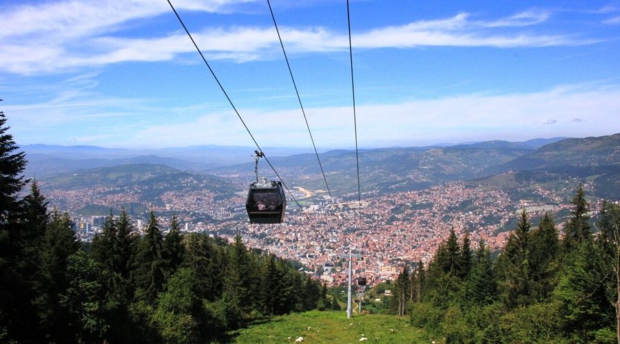 The Sarajevo Cable Car ascending Mount Trebević, with city views in the background.