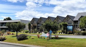Fiordland Lakeview Motel and Apartments in Te Anau, image may contain: Neighborhood, Grass, Person, Bench