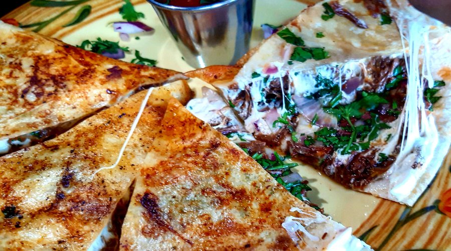 Birria Quesadilla
Shredded stew beef brisket in soft guajillo sauce, chihuahua cheese, flour tortilla, onions, cilantro with dipping beef broth