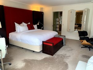 The Spire Hotel Queenstown in Queenstown, image may contain: Chair, Furniture, Lamp, Bed