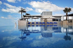 Grand Cosmopolitan Hotel - Dubai in Dubai, image may contain: Pool, Villa, Hotel, Swimming Pool