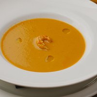 Shellfish bisque with langoustine tail and basil oil. Photos by Cargofolk.