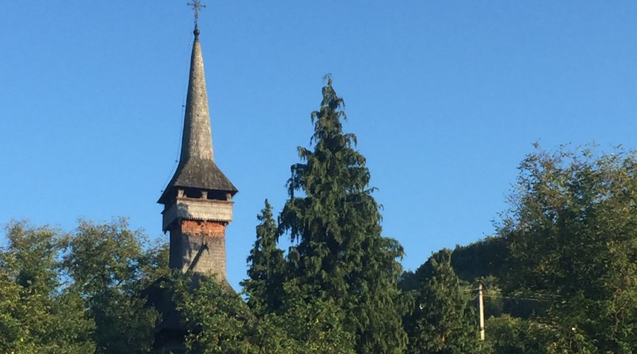 "...up the hill, the headstones lie" ...the church is there too. 