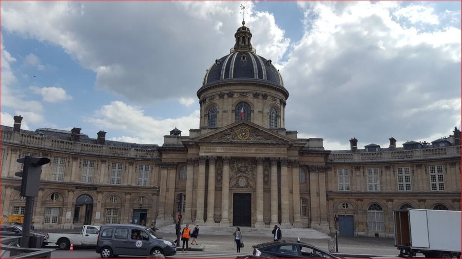 Pont des Arts. Institut de France is located at one entry point of the bridge.