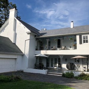 The back of the house, with patio and Coyner Room balcony