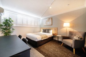 Fitzroy Motor Inn in Grafton, image may contain: Home Decor, Dorm Room, Furniture, Chair