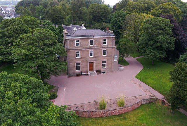 Aerial photo of front of house and gardens