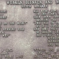 The text of Wynken, Blynken and Nod Dutch Lullaby in front of the fountain